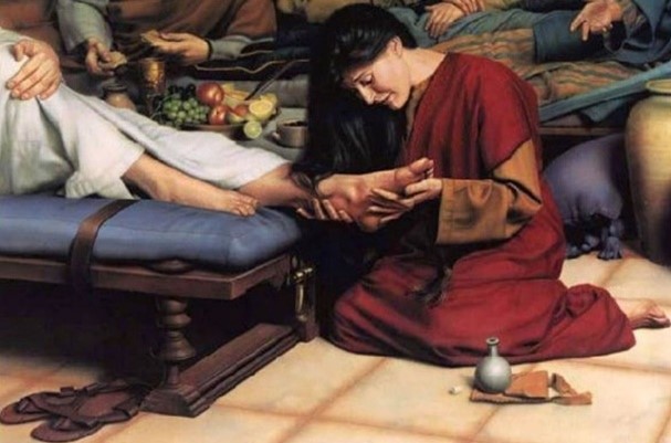 The woman ministering to Jesus’ feet