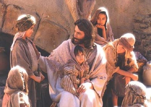 Jesus embraces children