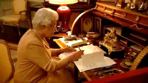 The Queen reviewing official documents