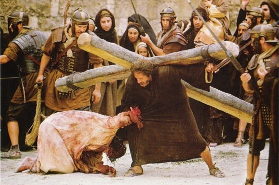Simon helps Jesus carry his cross